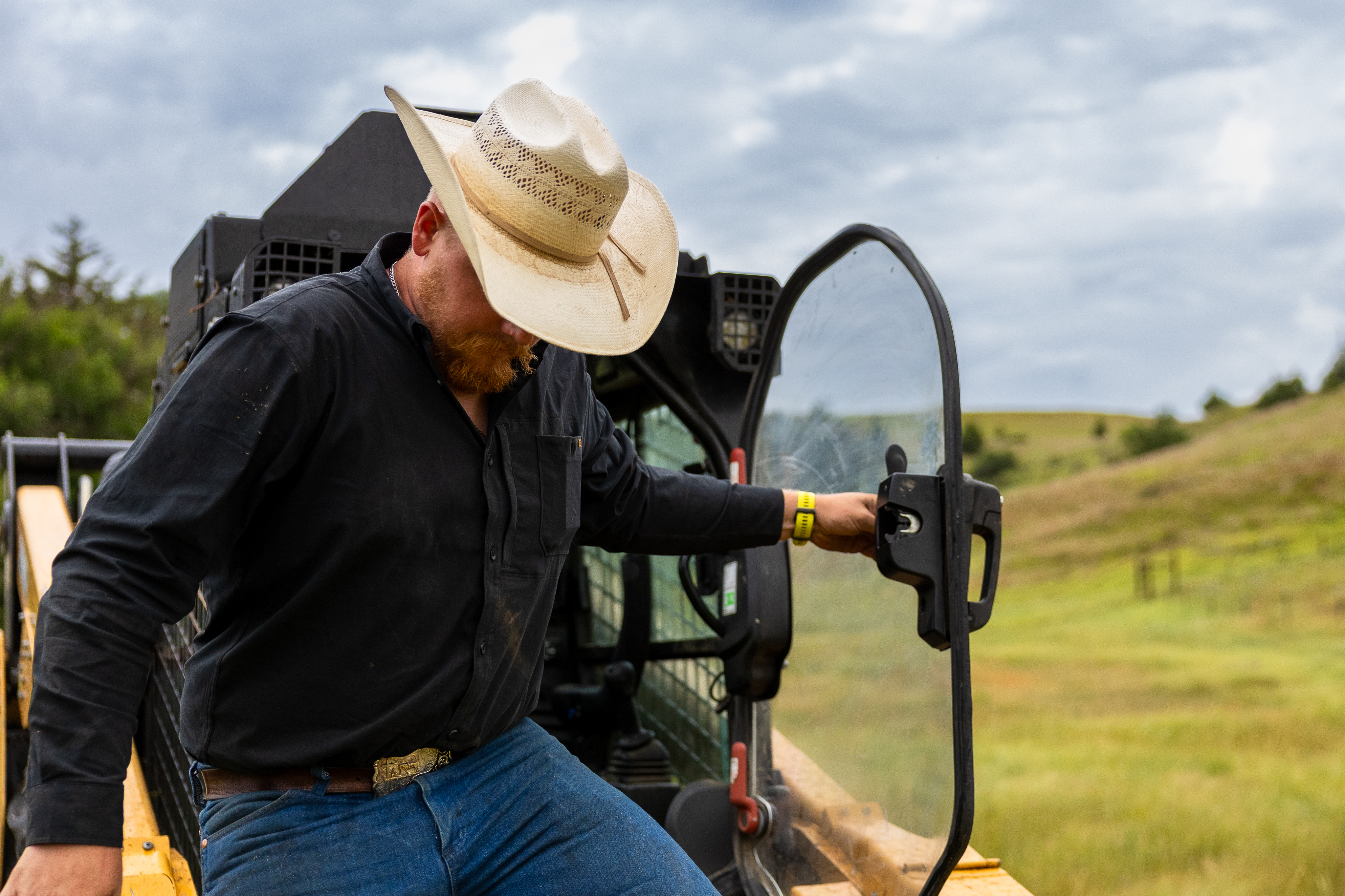 person exiting a skid steer